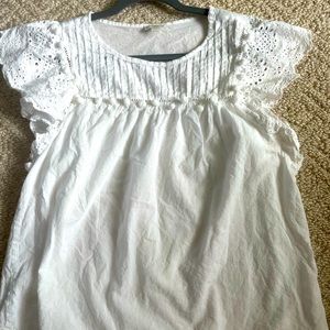 Women’s white eyelet sleeve blouse.
